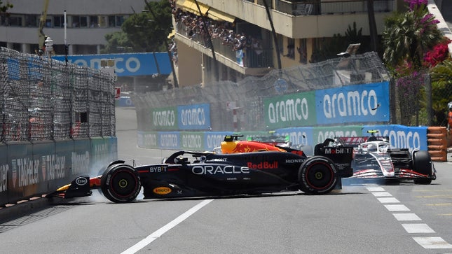 Mexico's Sergio Perez driving the (11) Oracle Red Bull Racing RB20 and Denmark's Kevin Magnussen driving the (20) Haas F1 VF-24 Ferrari (hidden) collide at the start during the F1 Grand Prix of Monaco at Circuit de Monaco in May January 26, 2024 in Monte-Carlo, Monaco. 